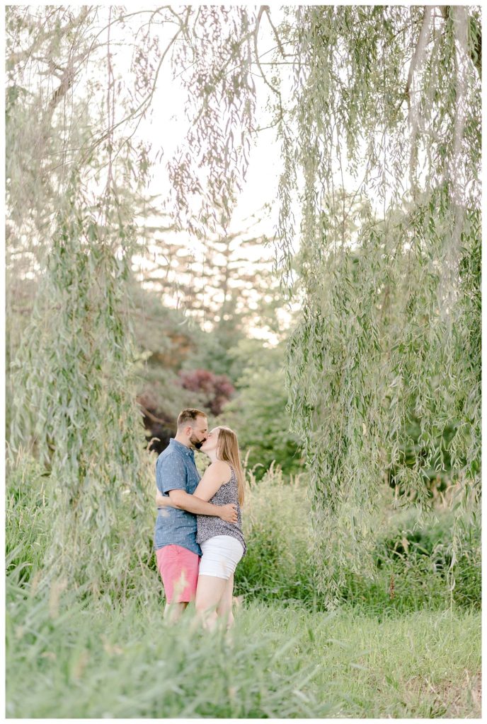 "couple kissing in weeping willows"